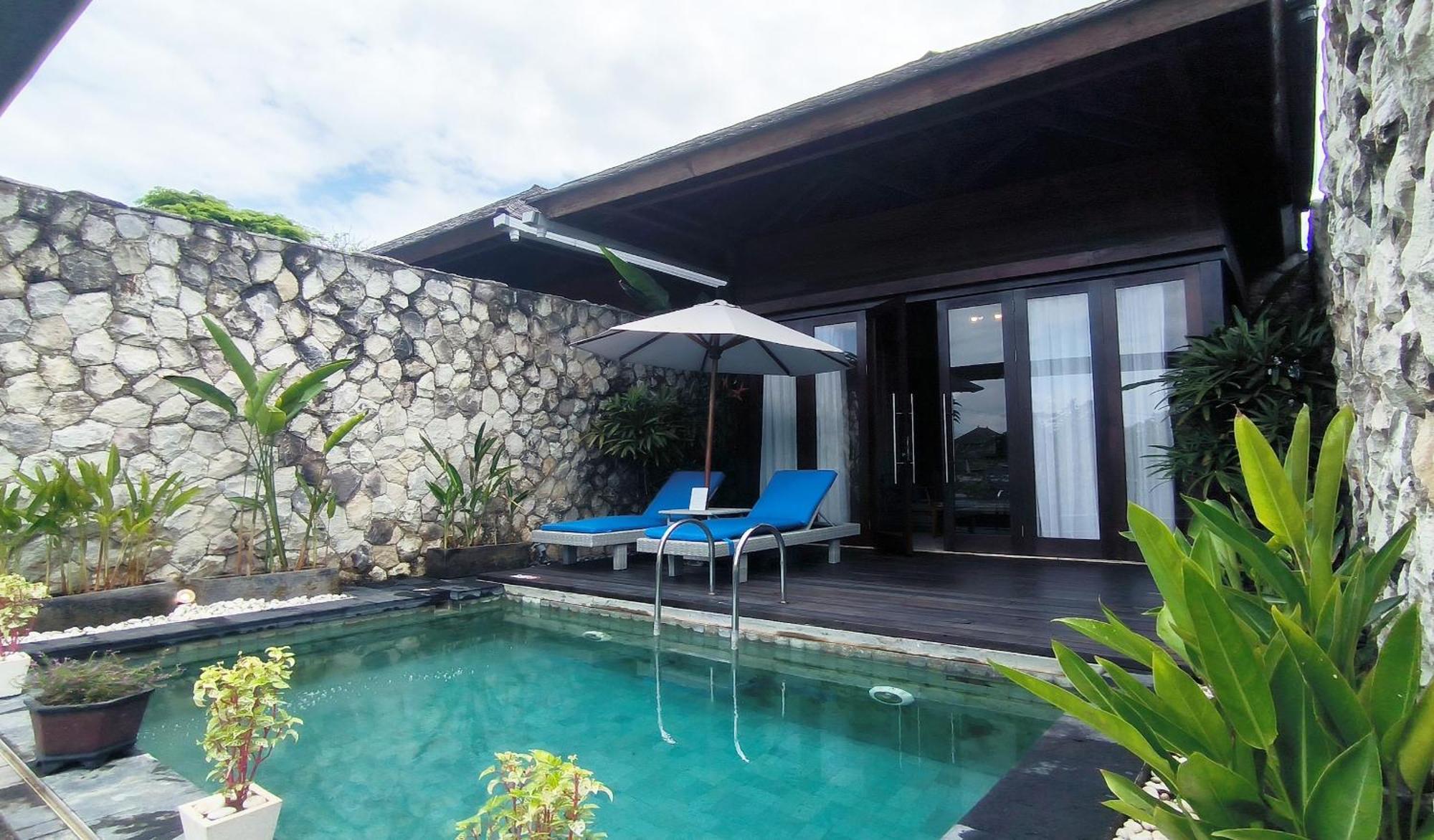 Siyut Wyndham Tamansari Jivva Resort Bali מראה חיצוני תמונה A pool villa at the resort